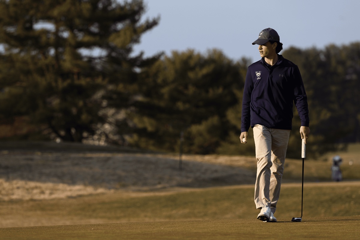Gilman golfer walking fairway at golden hour