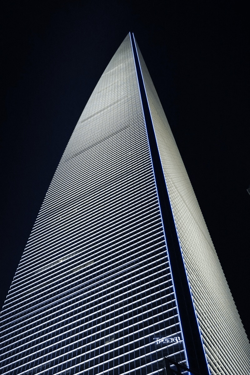 Shanghai skyscraper looking straight up at night