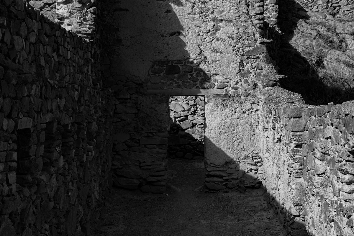 Black and white stone doorway inside Inca ruins