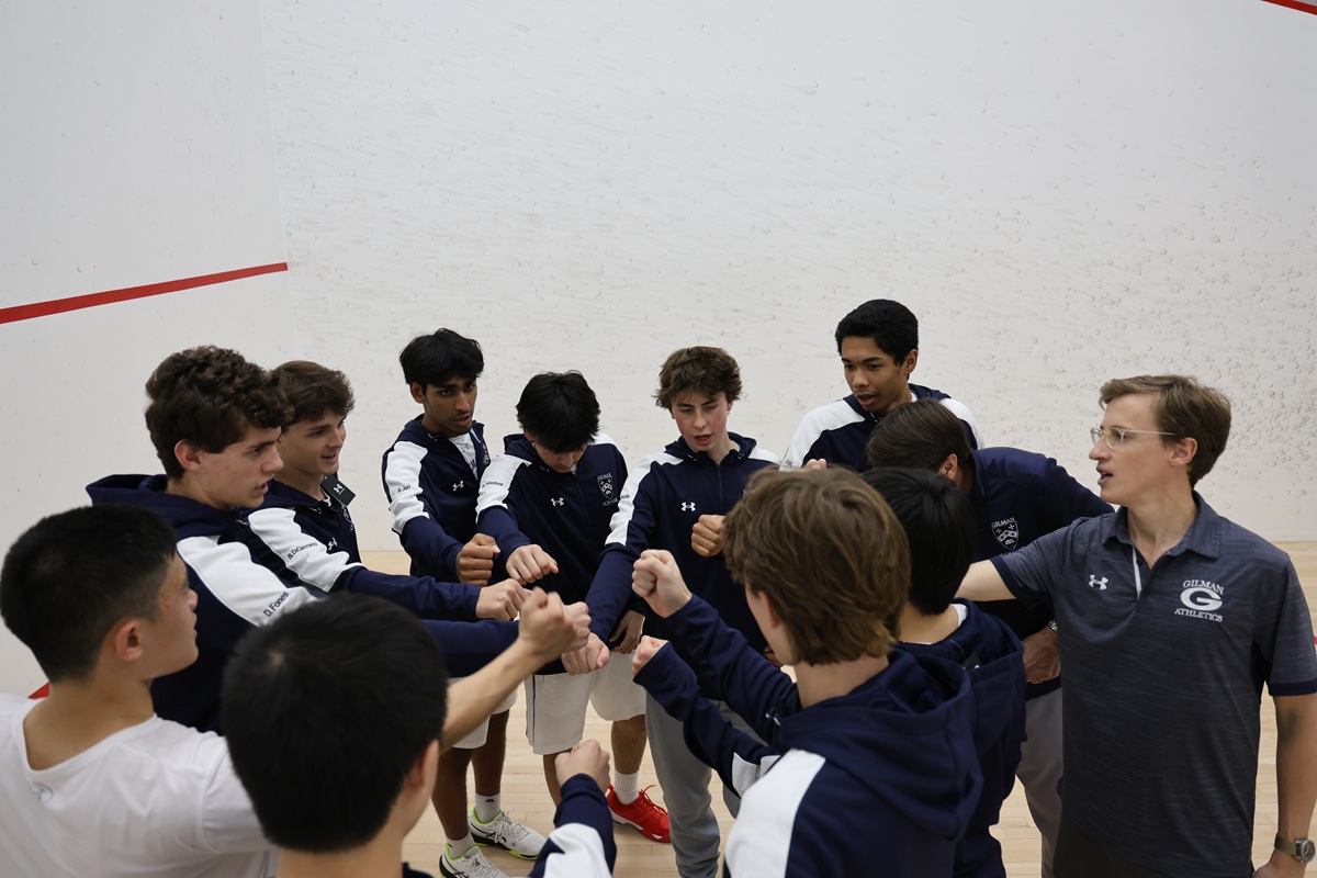Gilman squash player mid-swing