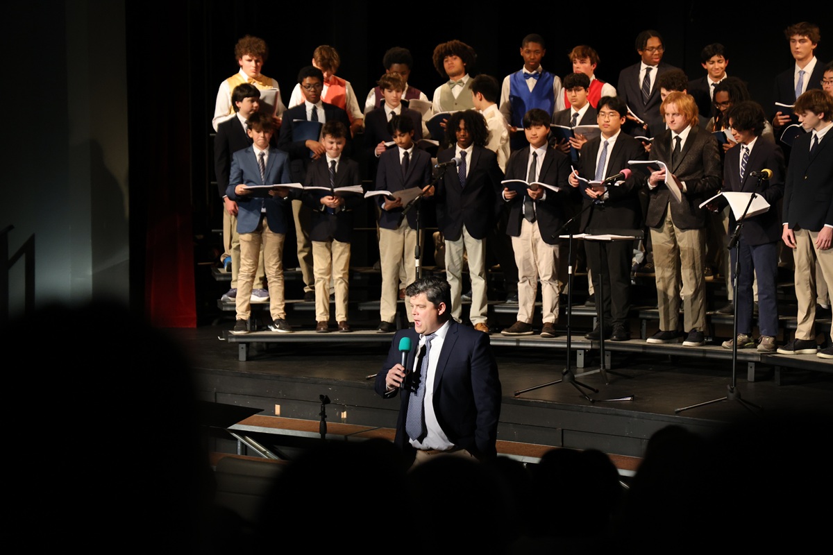 Boys choir performing with soloist at microphone