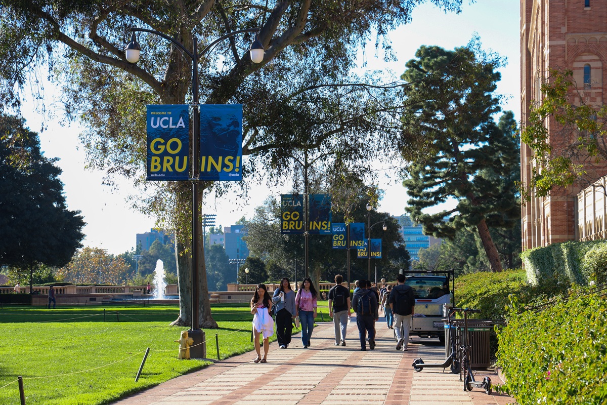 UCLA campus walk lined with Go Bruins banners