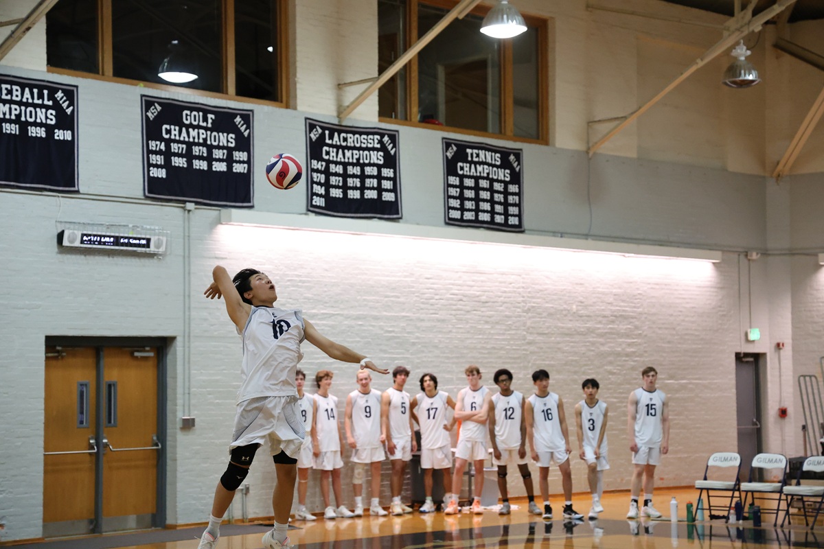 Volleyball player leaping to serve